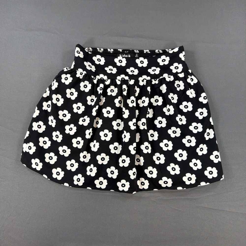 charming black pull-on skort from Kidpik features a playful allover Small